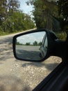 the reflected road in the rearview mirror Royalty Free Stock Photo