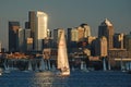 Reflected sunlight illuminates sailboat race