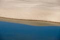 Reflecting Sand Dune in Blue Lagoon Water