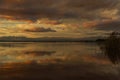 Reflecting yellow-red clouds in Lake Albufera Royalty Free Stock Photo