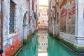 reflectio of old facades in a narrow canal in Venice