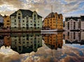 Reflection of art nouveau buildings at sunset in the town of Alesund in Norway Royalty Free Stock Photo