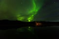 Reflection of Aurora Borealis over Olnes pond in Fairbanks, Alaska