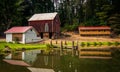 Reflection of barn and house in a small pond in rural York Count Royalty Free Stock Photo