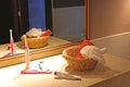 Reflection of a basket with towels and a toothbrush in a bathroom mirror Royalty Free Stock Photo