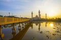 Reflection of beautiful Ampuan Jemaah mosque during sunrise. Royalty Free Stock Photo