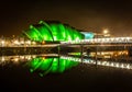 Reflection of a beautiful building with green in the lake lights in Glasgow Royalty Free Stock Photo