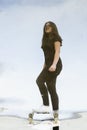 Skateboard girl puddle reflection Royalty Free Stock Photo