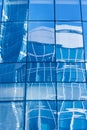 Reflection in blue glass wall of an modern office building Royalty Free Stock Photo
