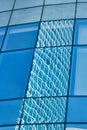Reflection in blue glass wall of modern office building Royalty Free Stock Photo