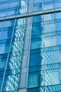 Reflection in blue glass wall of modern office building Royalty Free Stock Photo