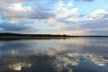 Reflection of blue sky and clouds in a lake Royalty Free Stock Photo