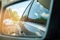 Reflection of blue sky on car side mirror Royalty Free Stock Photo