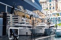 Reflection of a boat and city on a glossy surface of a huge yacht at sunny day, the chrome plated handrail, megayacht is