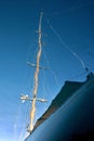 Reflection of a brown yacht mast