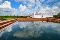 Reflection of a Buddhist temple on water at Lumbini, the birth place of Buddha