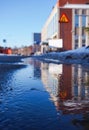 Reflection of a building in a frozen puddle Royalty Free Stock Photo