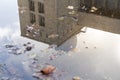 Reflection of a building in a puddle Royalty Free Stock Photo