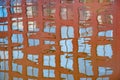 Reflection of the building windows in the relatively calm river