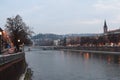 Reflection of buildings of Verona city on the Adige river in Autu