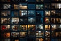 Reflection of buildings in windows of modern office building at night, A photo of a night city, an apartment building, lots of Royalty Free Stock Photo