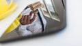 Reflection of a businessman in white shirt building a tower of w