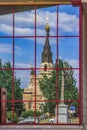 Reflection of Cathedral on the city street in the glass facade
