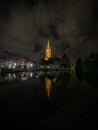 Reflection of catholic gothic cathedral church of our lady Onze Lieve Vrouwekerk in river canal channel Bruges Belgium Royalty Free Stock Photo