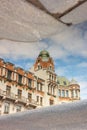 reflection of city mansion in the water. architecture and sights. historic building in city center.