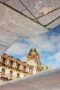 reflection of city mansion in the water. architecture and sights. historic building in city center.