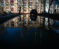 View of a simple Russian provincial town in reflection in the water.