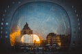 Reflection of cityscape in Rotterdam on the facade of Market Hall Markthal during golden hour