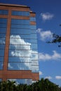 Reflection of clouds on modern office building Royalty Free Stock Photo