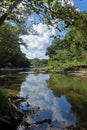 Reflection of Clouds and trees in the Water Royalty Free Stock Photo