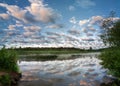 Reflection of clouds in the water. Early morning on the Ugra river Royalty Free Stock Photo