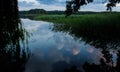 Reflection of clouds in the water surface. Just before golden hour Royalty Free Stock Photo