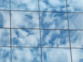 The reflection of the cloudy sky in the glass wall Royalty Free Stock Photo