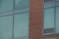 Reflection of cloudy sky in glass wall of modern office building Royalty Free Stock Photo