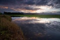 Reflection of colorful sunrise and dramatic clouds Royalty Free Stock Photo