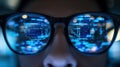 Reflection of computer code in programmer's glasses Royalty Free Stock Photo