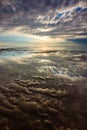 Reflection of dramatic sky at Nusa Dua beach, Bali