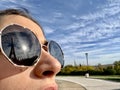 Reflection of the Eiffel Tower in a person glasses. Reflection of the Paris tower in a woman glasses