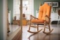 reflection of an empty chair rocking by itself