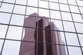 The facade of a modern building. Reflection in the facade of another building Royalty Free Stock Photo