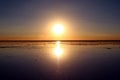 Reflection of the Famous Mirror effect at Sunset on Uyuni Salt Flats or Salar de Uyuni in Bolivia, South America Royalty Free Stock Photo