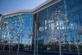 reflection of the Ferris wheel in the facade of the shopping center. Ulyanovsk