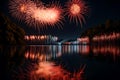 A reflection of fireworks in a calm, tranquil lake