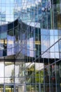 Reflection of a fragment of a modern building on the glass facade