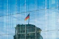 reflection of the german flag on Reichstag building in modern glass facade - Royalty Free Stock Photo