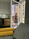 Reflection of a girl moving in the glass of the balcony door Royalty Free Stock Photo